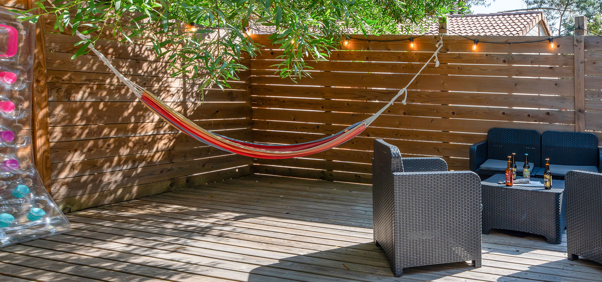 Camping san damiano bungalow giglio terrasse hamac salon